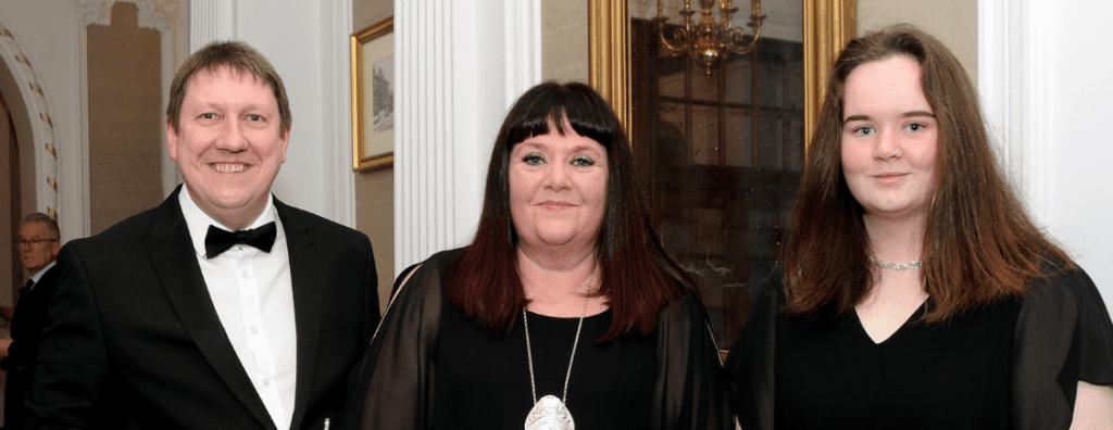 Lisa Haythorne MBE (centre) with husband Stephen and daughter Hannah.